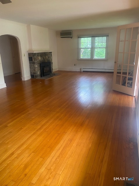 33 Flanders Road Bethlehem, CT 06751 - Photo 5 of 18 a view of empty room with wooden floor and fan