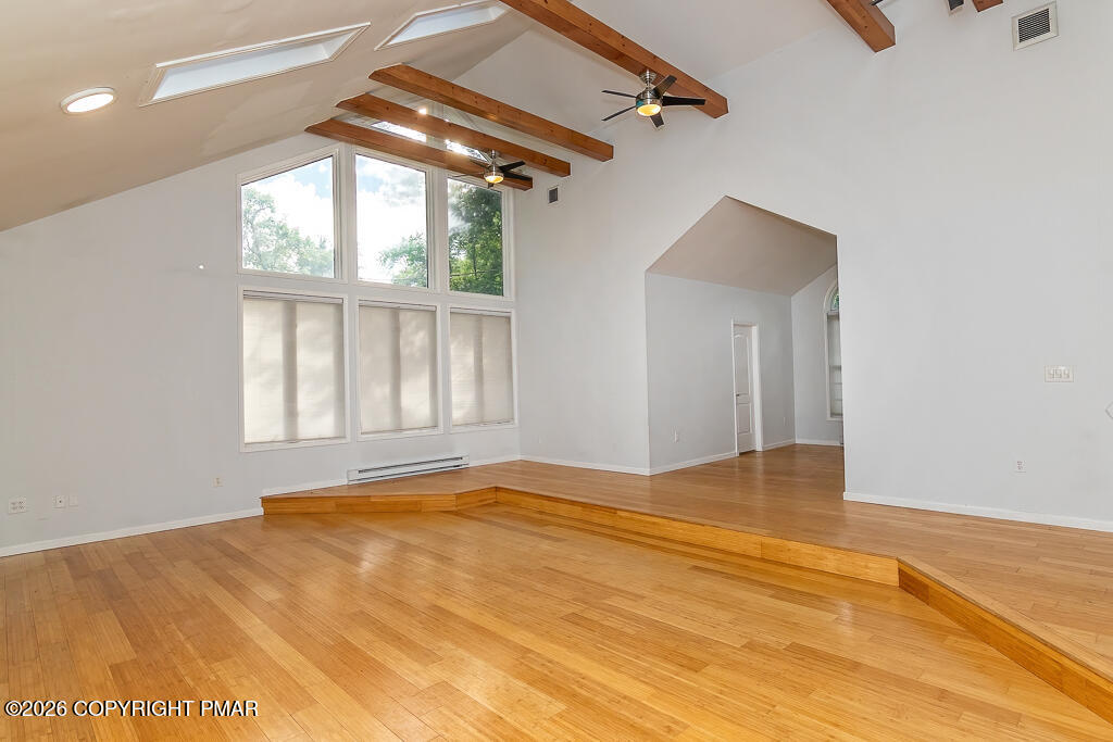755 White Oak Road Cresco, PA 18326 - Photo 17 of 50 a view of an empty room with wooden floor and a window