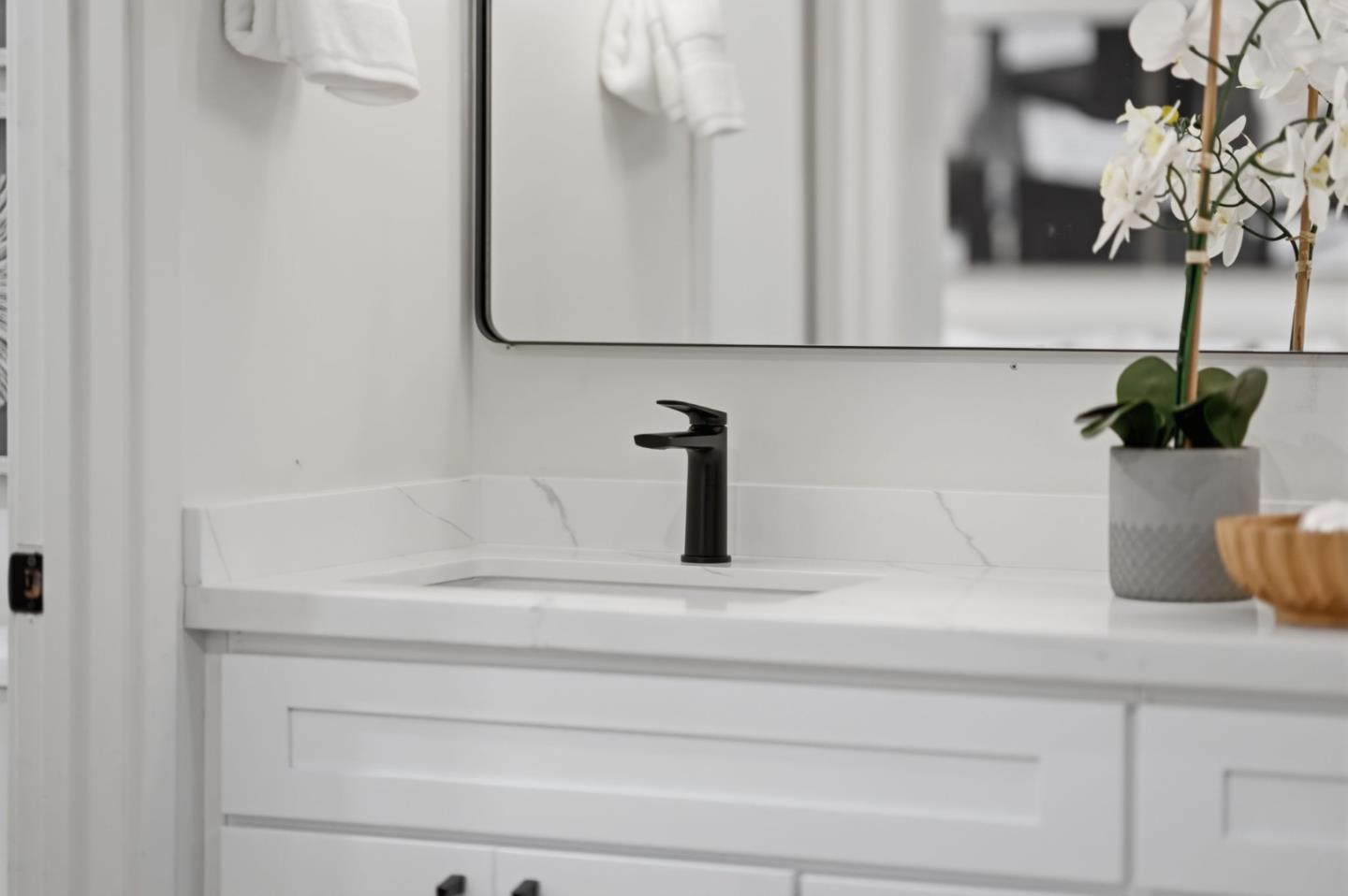 409 Puerto Place Hayward, CA 94541 - Photo 32 of 54 a bathroom with a sink and a mirror