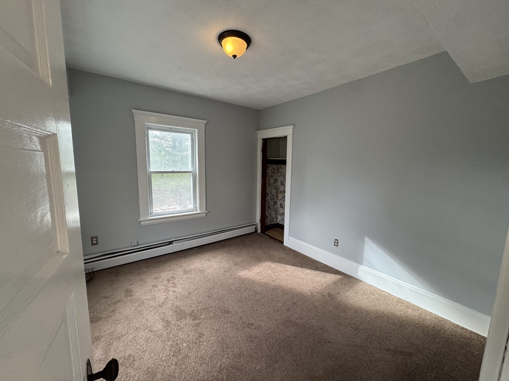 41 Thorndike Road, Unit 2 North Andover, MA 01845 - Photo 6 of 8 an empty room with windows
