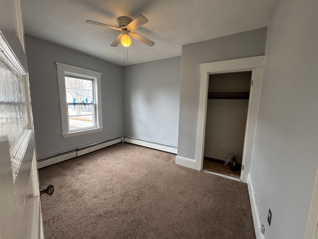 41 Thorndike Road, Unit 2 North Andover, MA 01845 - Photo 7 of 8 an empty room that has a window in it
