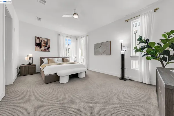 a bed room with a bed and a couch