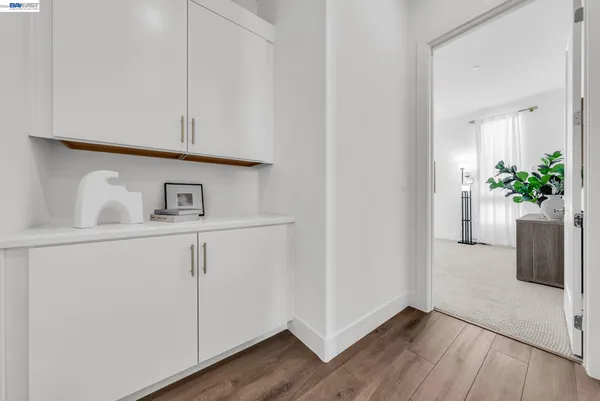 a spacious bathroom with a tub shower and a sink