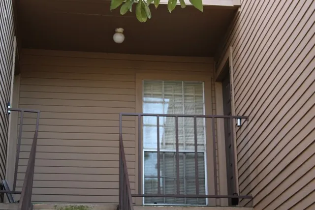 a view of a room with toys and wooden floor