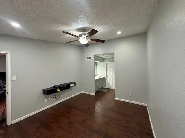a spacious bathroom with a double vanity sink and a mirror