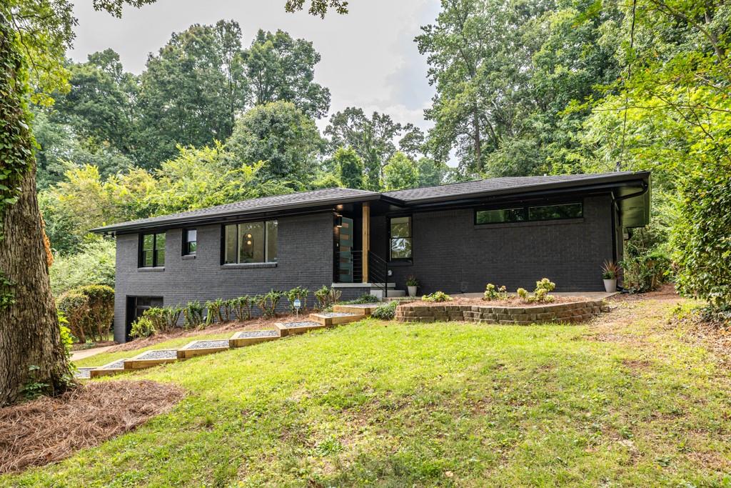 2882 Rockcliff Road Southeast Atlanta, GA 30316 - Photo 1 of 1 a view of a house with a yard