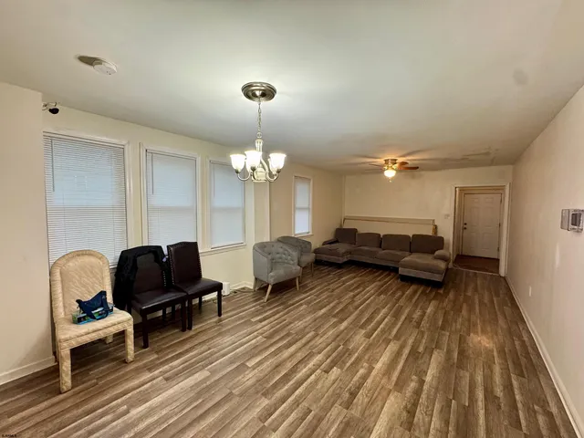 a living room with furniture fireplace and rug