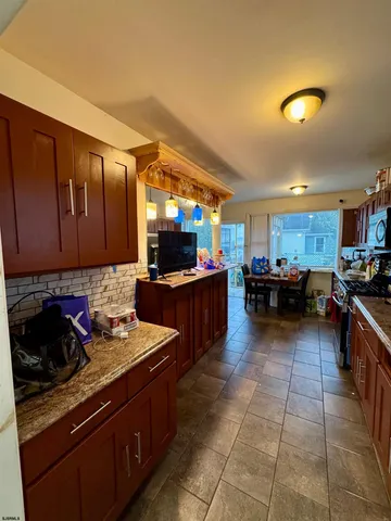 a kitchen with stainless steel appliances granite countertop a stove and a sink