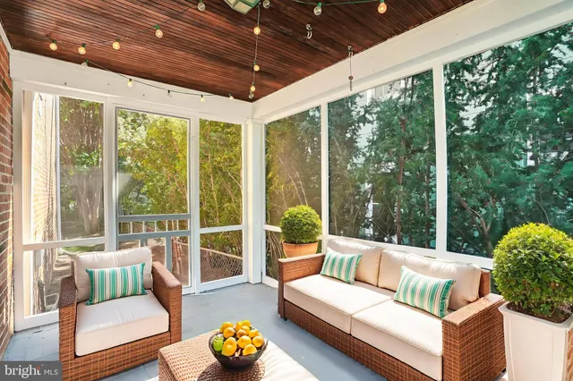 a outdoor living space with patio furniture and garden view