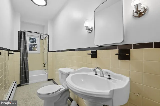 a view of a bedroom with wooden floor and windows