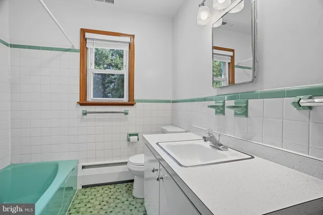 a view of an empty room with stairs