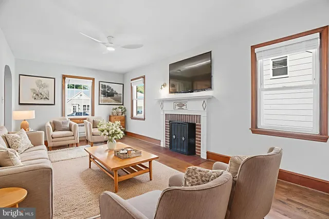 a living room with furniture fireplace and a flat screen tv