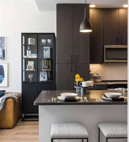 a bedroom with a bed and large window