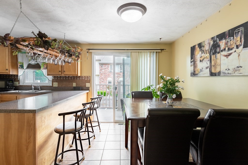 3 Woodland Street, Unit 16 Lawrence, MA 01841 - Photo 11 of 29 a dining room with furniture and window