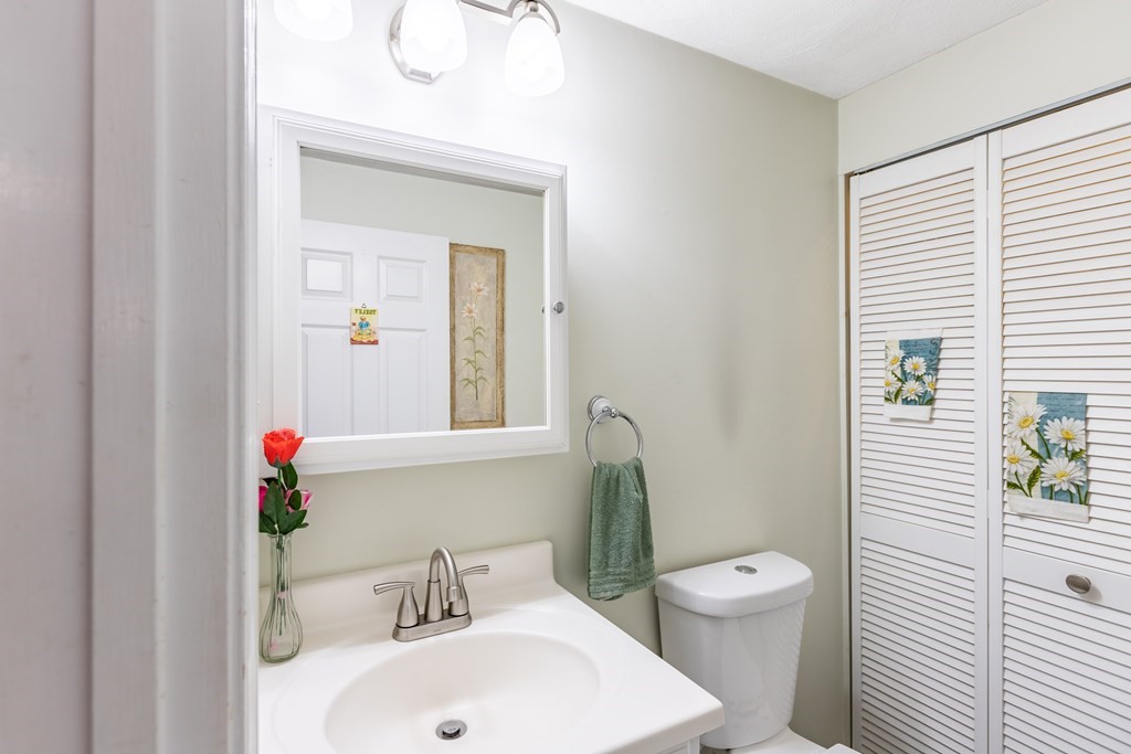 3 Woodland Street, Unit 16 Lawrence, MA 01841 - Photo 16 of 29 a bathroom with a sink a toilet and shower curtain