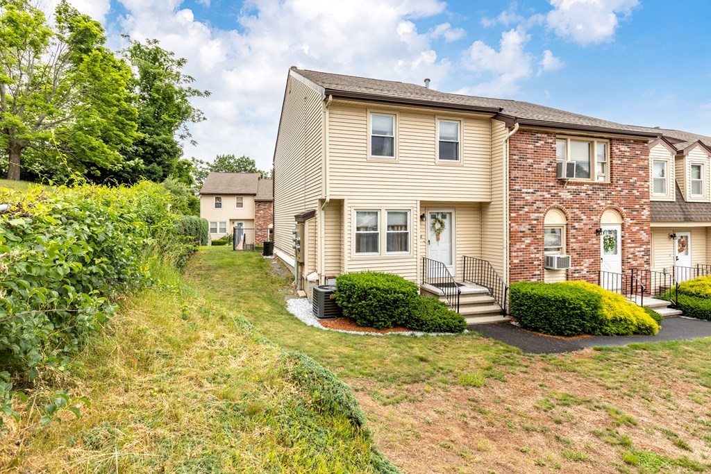 3 Woodland Street, Unit 16 Lawrence, MA 01841 - Photo 2 of 29 a front view of a house with garden