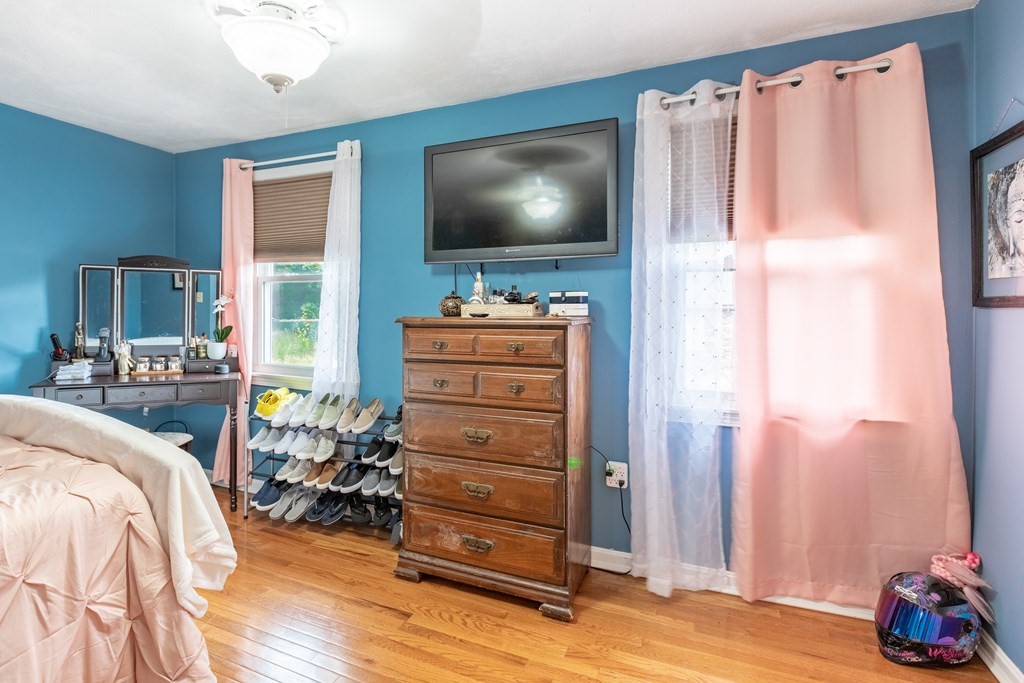 3 Woodland Street, Unit 16 Lawrence, MA 01841 - Photo 22 of 29 a living room with furniture and a flat screen tv