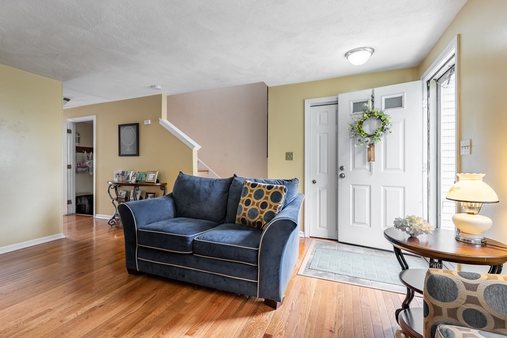 3 Woodland Street, Unit 16 Lawrence, MA 01841 - Photo 4 of 29 a living room with furniture and wooden floor