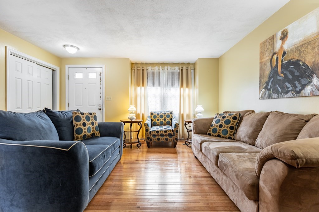 3 Woodland Street, Unit 16 Lawrence, MA 01841 - Photo 5 of 29 a living room with furniture and wooden floor