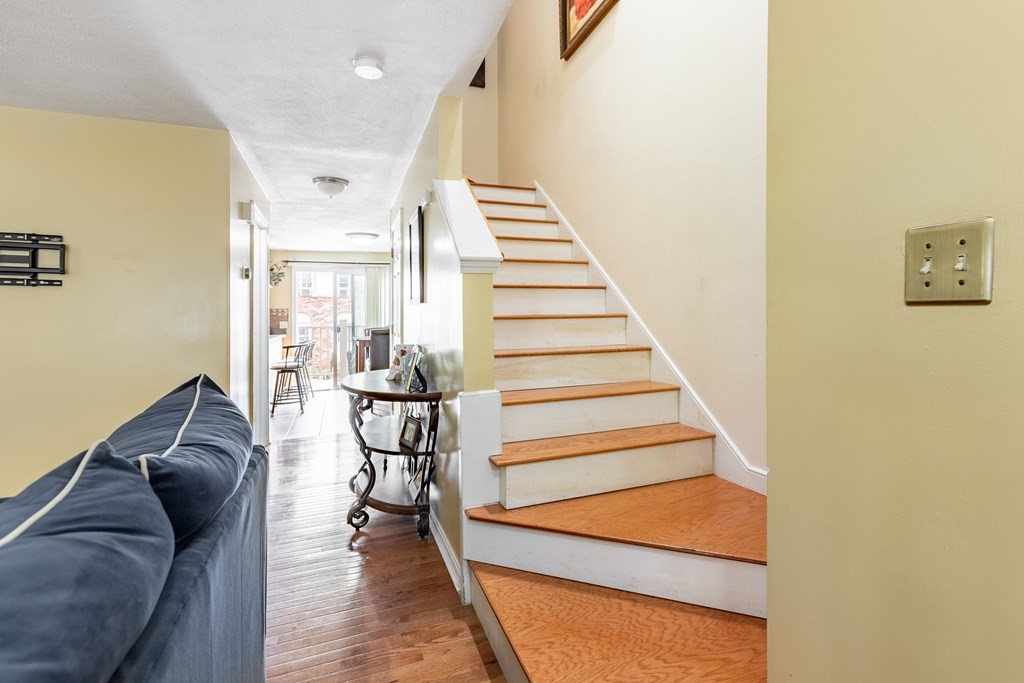 3 Woodland Street, Unit 16 Lawrence, MA 01841 - Photo 8 of 29 a living room with furniture and wooden floor