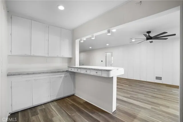 a kitchen with a sink stainless steel appliances and cabinets