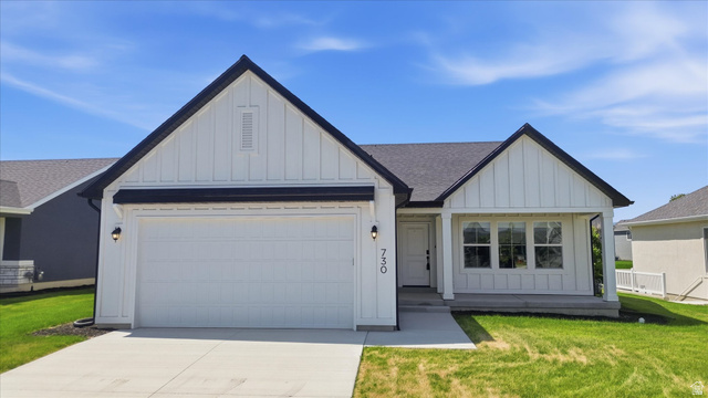 730 West 500 North Smithfield, UT 84335 - Photo 36 of 46 White vertical siding exterior with black trim and dark roof shingles