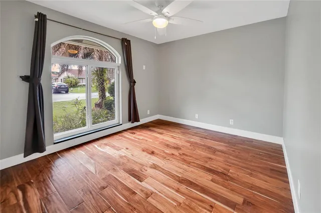 a bathroom with a granite countertop sink a toilet and a mirror