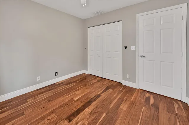 a view of backyard of house with wooden deck