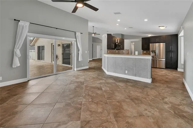 a view of a kitchen with a sink and cabinets