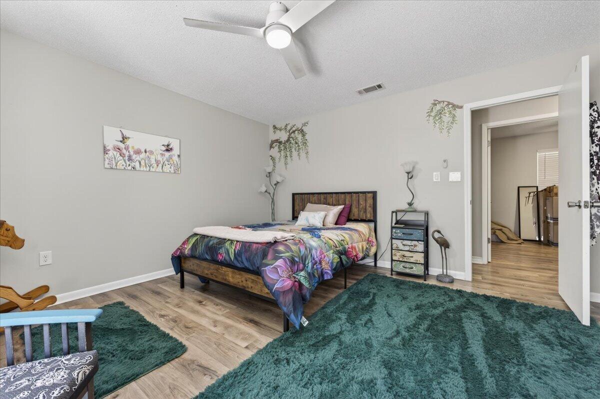 210 Shell Drive Crestview, FL 32536 - Photo 28 of 67 a bedroom with a bed and a view of walk in closet