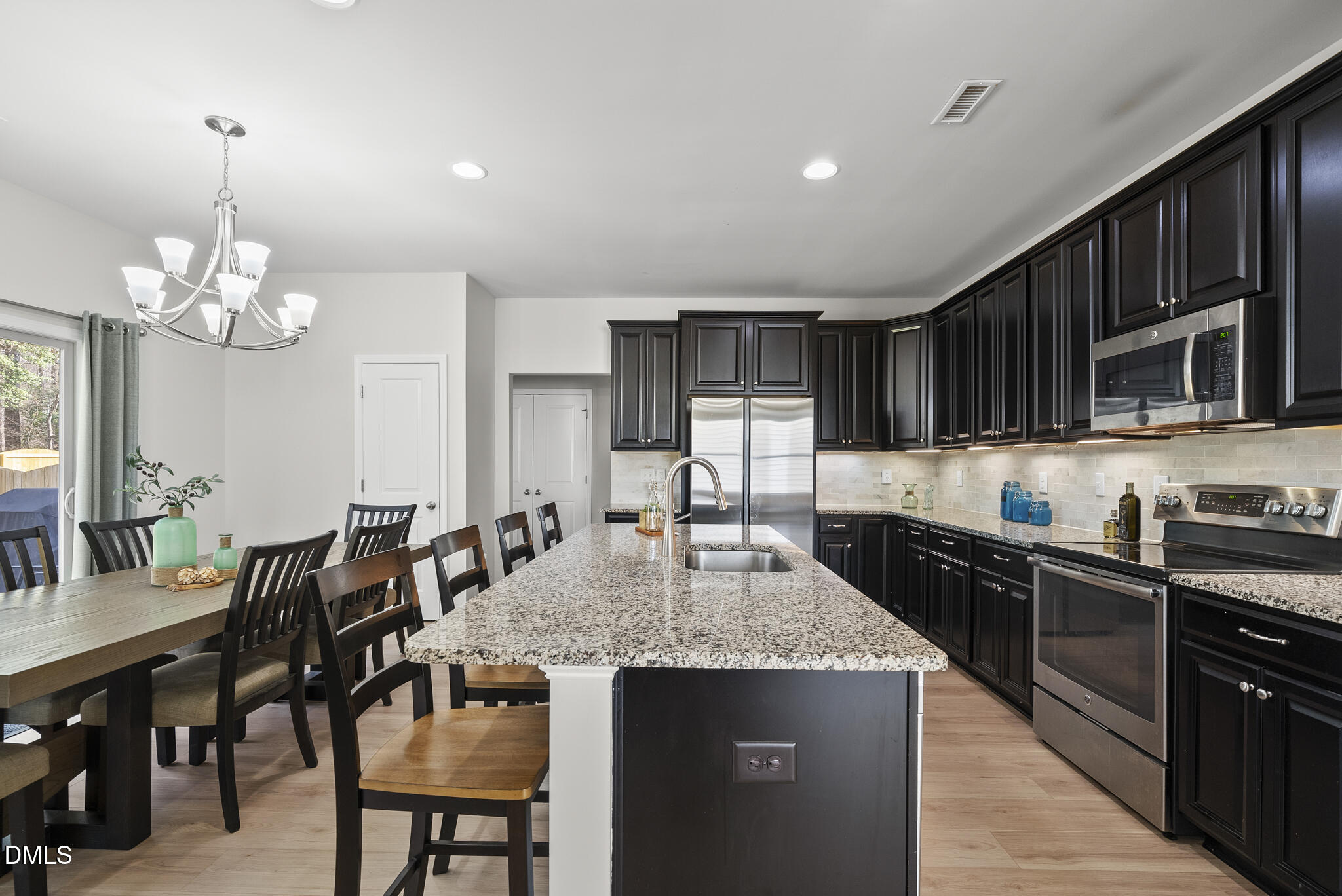 332 Forbes Road Wake Forest, NC 27587 - Photo 10 of 32 a kitchen with granite countertop lots of counter top space and stainless steel appliances