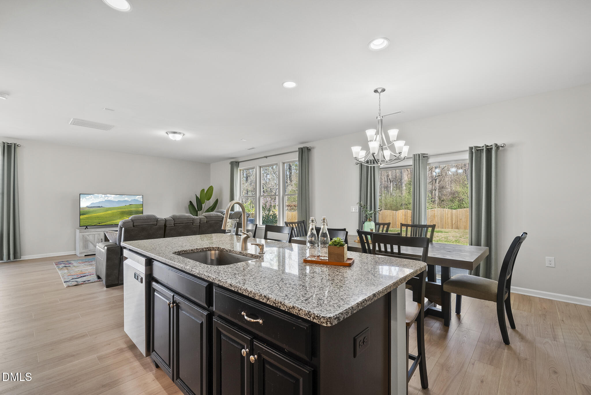 332 Forbes Road Wake Forest, NC 27587 - Photo 12 of 32 a view of a dining room with furniture and chandelier