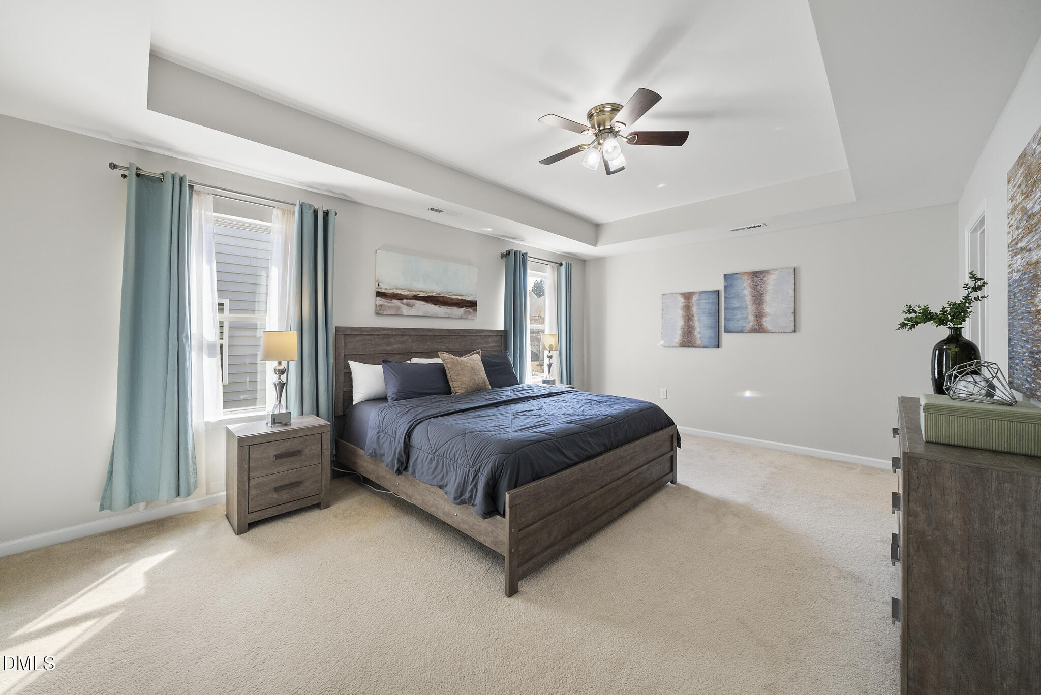 332 Forbes Road Wake Forest, NC 27587 - Photo 14 of 32 a bedroom with a large bed and a chandelier fan