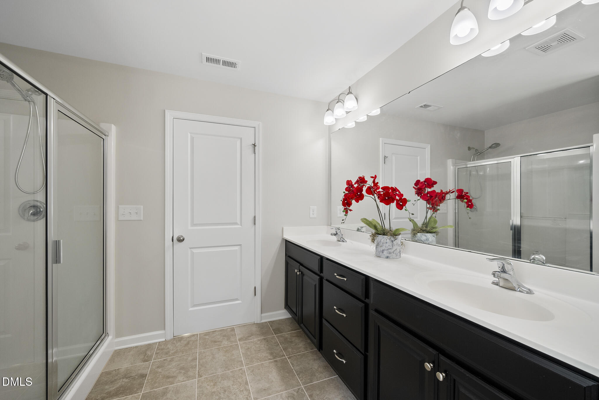 332 Forbes Road Wake Forest, NC 27587 - Photo 19 of 32 a bathroom with a granite countertop double vanity sink mirror and shower