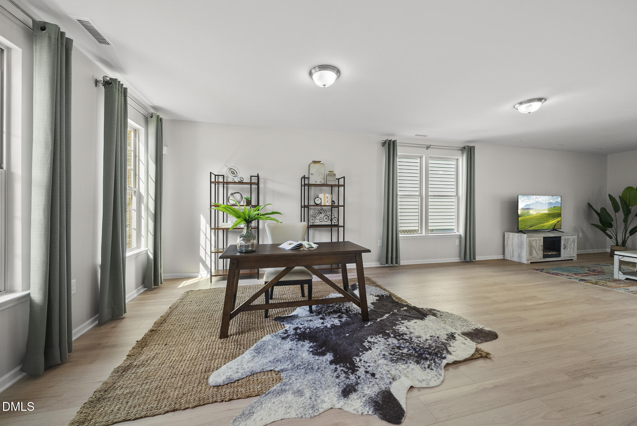 332 Forbes Road Wake Forest, NC 27587 - Photo 3 of 32 a living room with furniture and wooden floor