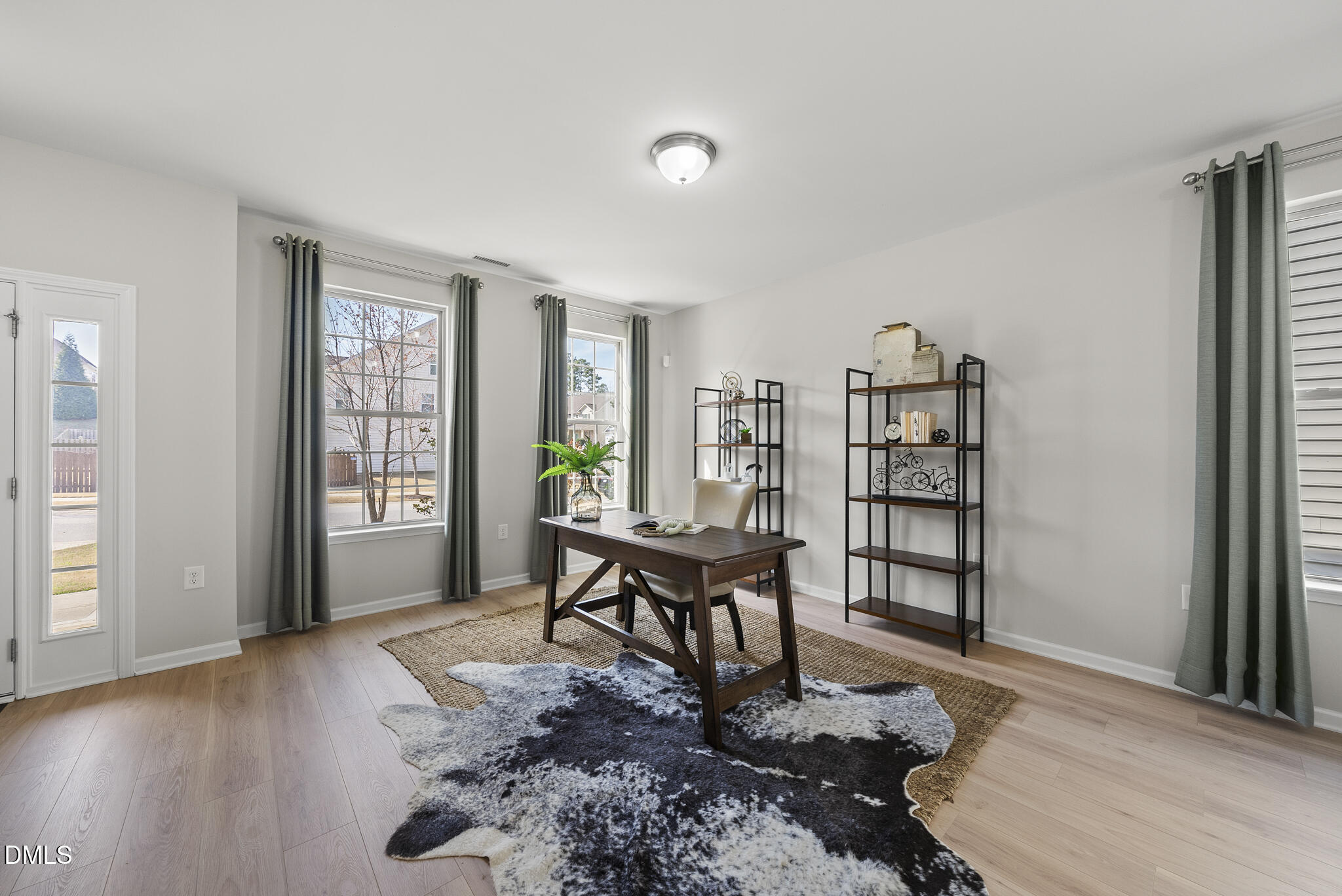 332 Forbes Road Wake Forest, NC 27587 - Photo 4 of 32 a living room with furniture a rug and a window