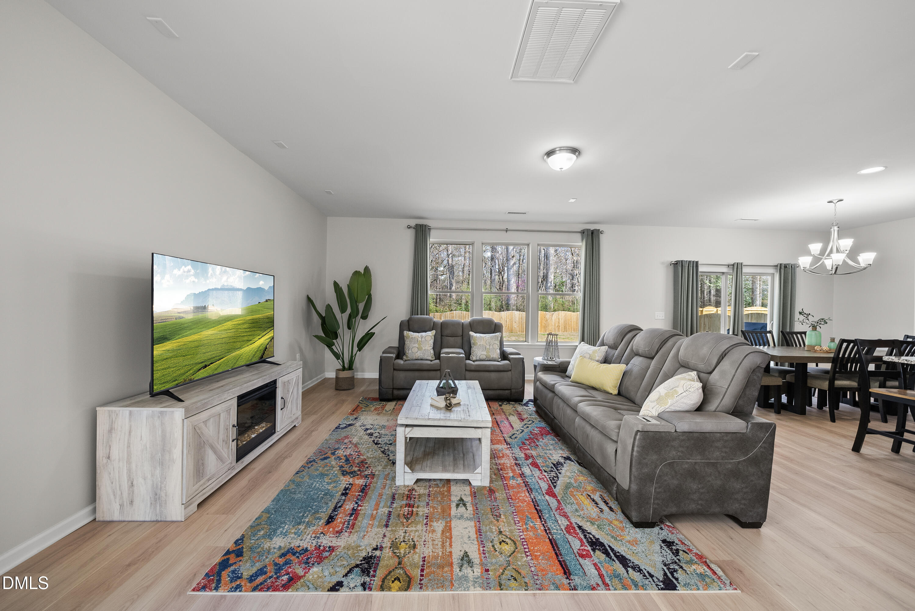 332 Forbes Road Wake Forest, NC 27587 - Photo 5 of 32 a living room with furniture and a flat screen tv