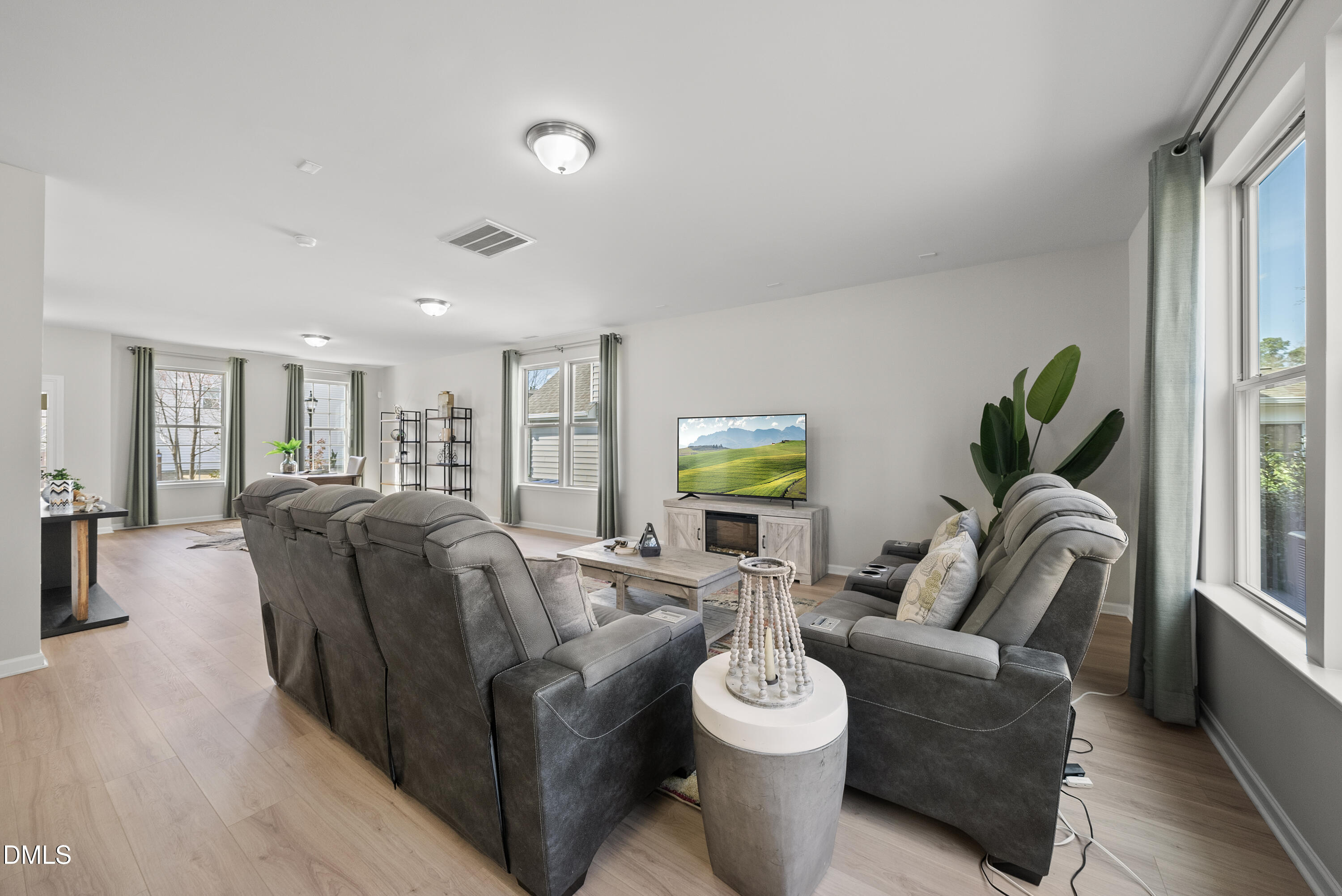 332 Forbes Road Wake Forest, NC 27587 - Photo 6 of 32 a living room with furniture and a wooden floor