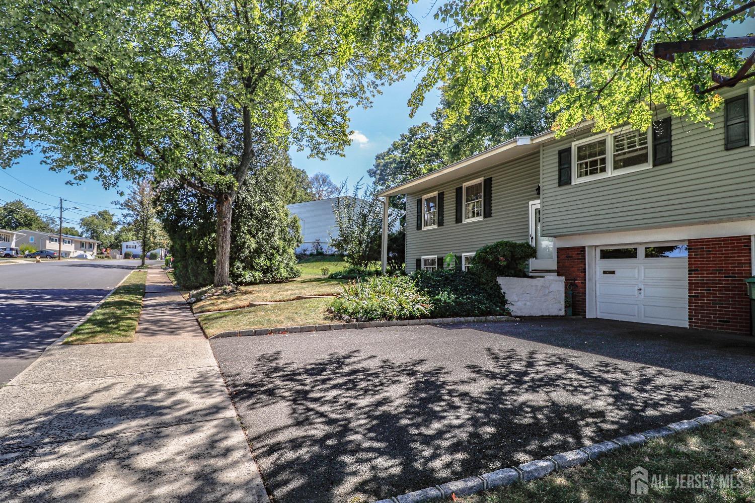 33 Harmon Road Edison, NJ 08837 - Photo 2 of 25 a front view of a house with a yard