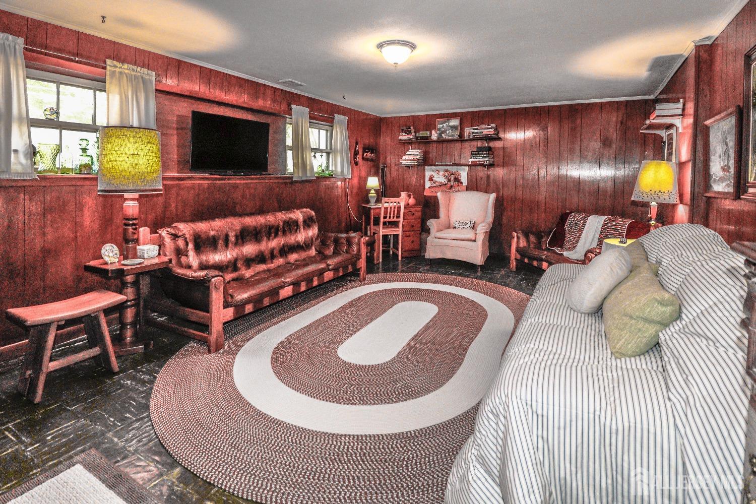 33 Harmon Road Edison, NJ 08837 - Photo 21 of 25 a living room with furniture and a flat screen tv