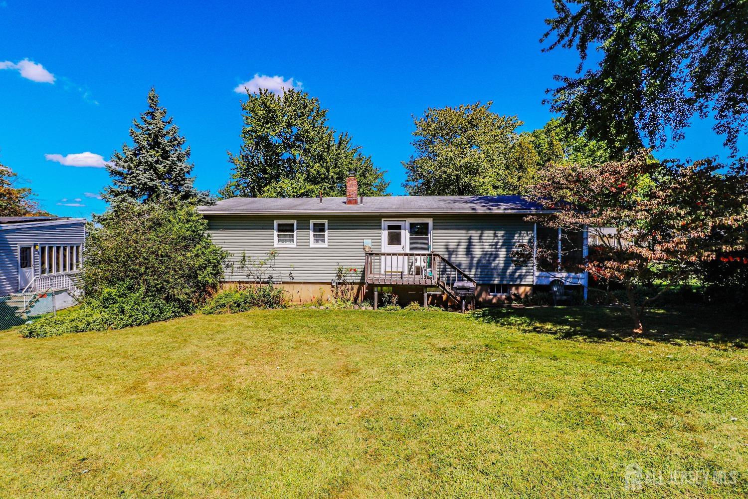 33 Harmon Road Edison, NJ 08837 - Photo 25 of 25 a view of a house with swimming pool and sitting area