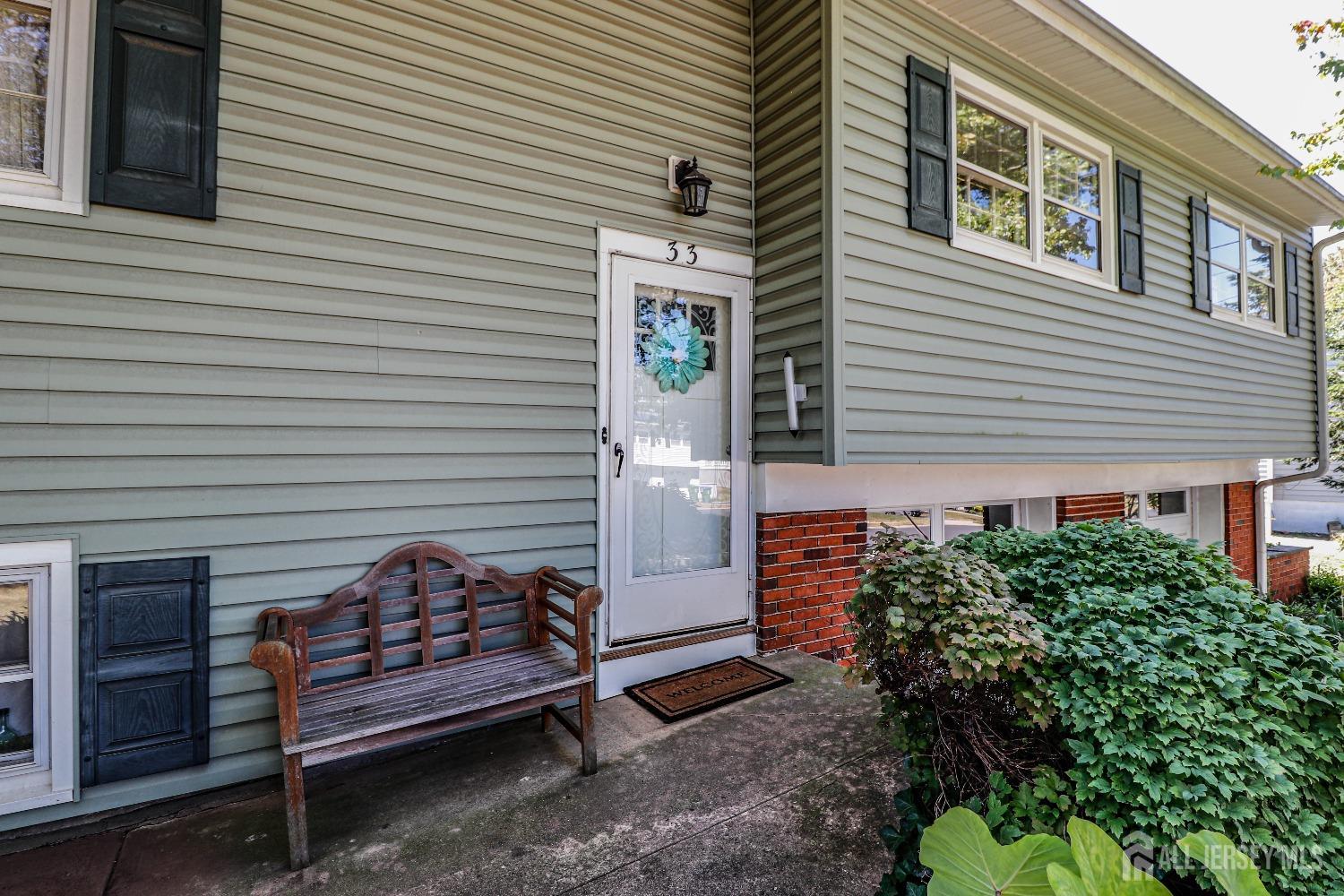 33 Harmon Road Edison, NJ 08837 - Photo 4 of 25 a view of a wooden door of the house