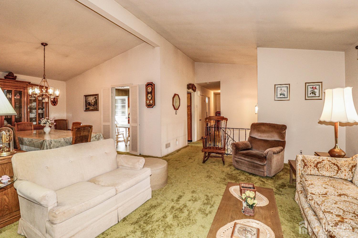 33 Harmon Road Edison, NJ 08837 - Photo 6 of 25 a living room with furniture a couch and a chandelier