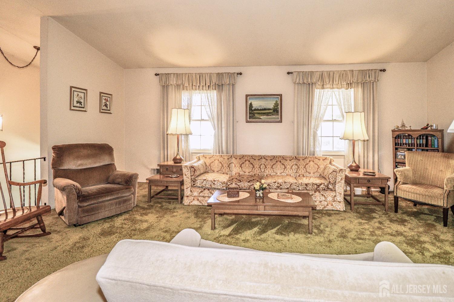33 Harmon Road Edison, NJ 08837 - Photo 10 of 25 a living room with furniture and a window