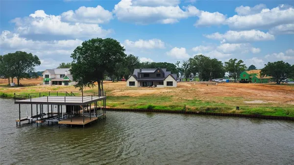 a view of a swimming pool with a yard