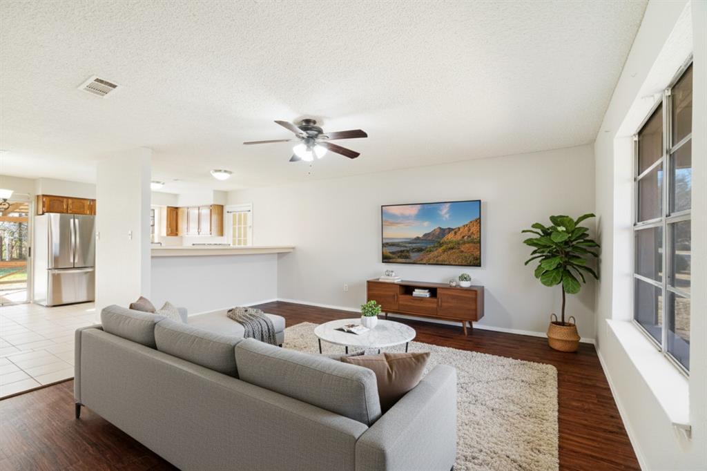 6450 Inwood Drive Reno, TX 75462 - Photo 1 of 1 a living room with furniture and a potted plant