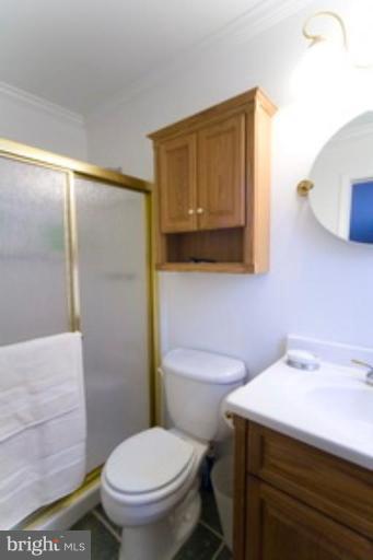 6512 Darwin Road Laurel, MD 20707 - Photo 13 of 22 a bathroom with a sink a toilet and mirror