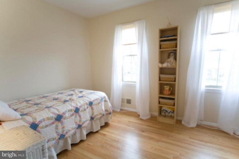 6512 Darwin Road Laurel, MD 20707 - Photo 16 of 22 a bedroom with a bed and a window