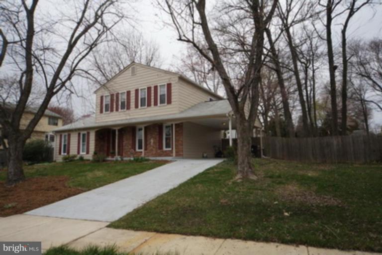 6512 Darwin Road Laurel, MD 20707 - Photo 17 of 22 a front view of a house with garden