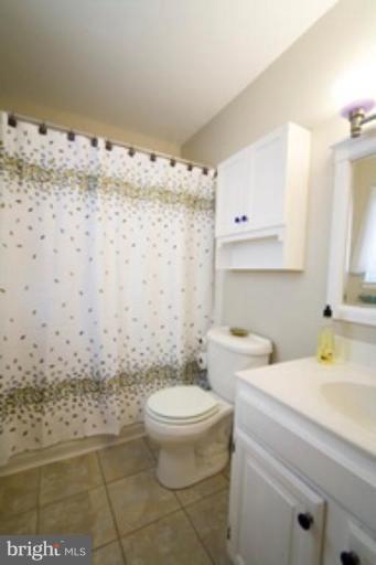 6512 Darwin Road Laurel, MD 20707 - Photo 20 of 22 a bathroom with a sink toilet and shower
